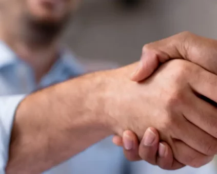 Client shaking mortgage brokers hand